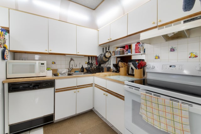 kitchen with sink, white appliances, backsplash, and white cabinetry