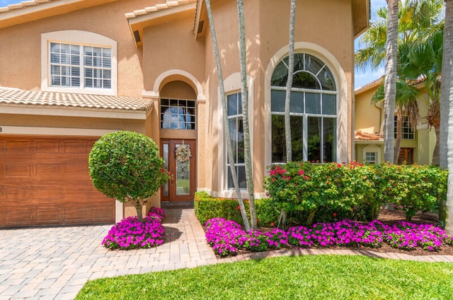 property entrance with a garage