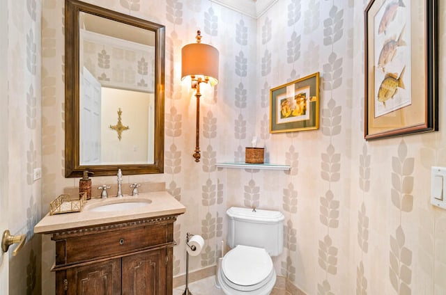 bathroom featuring oversized vanity, crown molding, and toilet