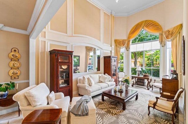 interior space with ornamental molding and a towering ceiling