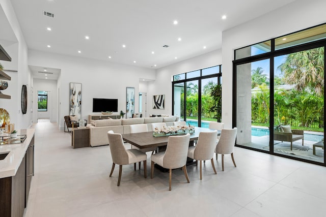 dining area featuring light tile patterned floors