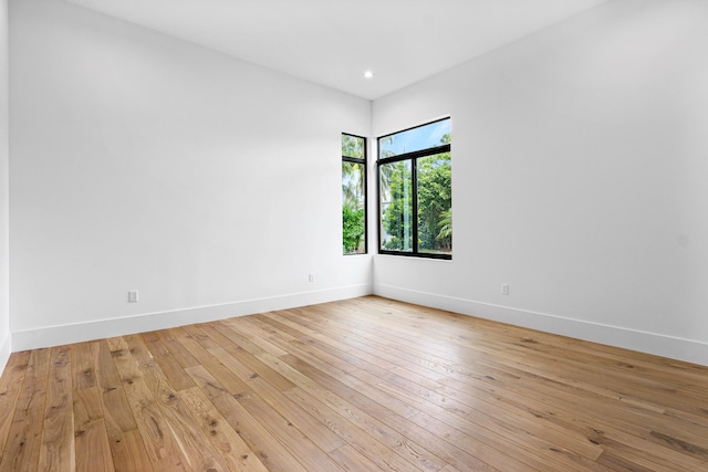 empty room with light hardwood / wood-style flooring