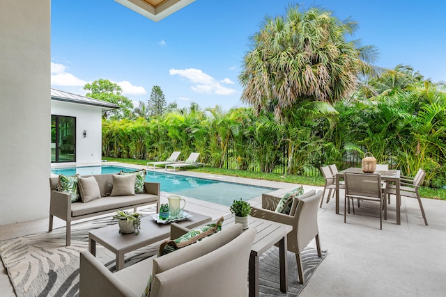 view of pool featuring outdoor lounge area and a patio area