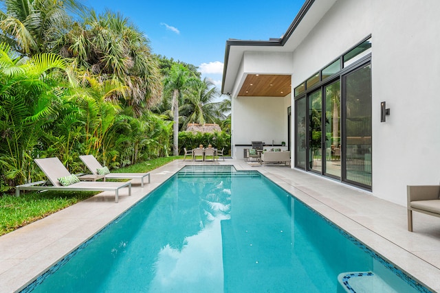 view of pool featuring a patio area