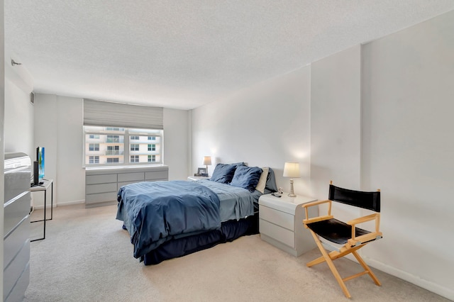 carpeted bedroom with a textured ceiling