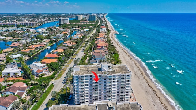 aerial view featuring a water view and a beach view