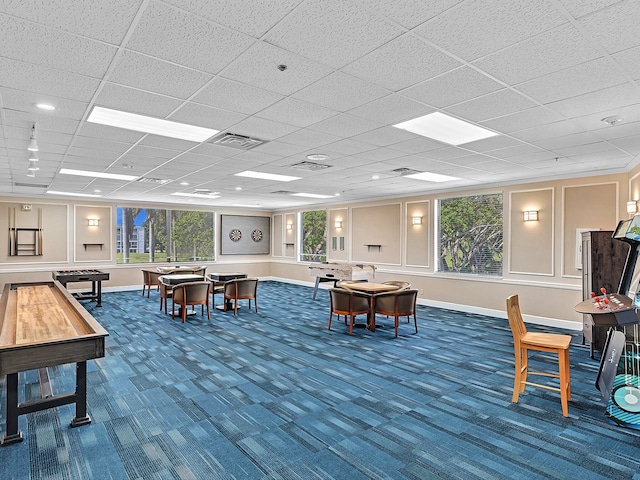 interior space with a healthy amount of sunlight and a drop ceiling