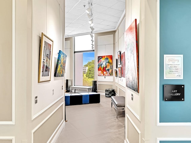 hall featuring light tile floors