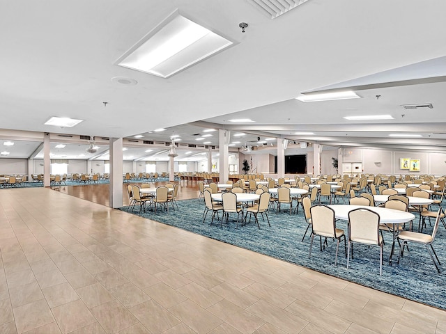 dining space featuring light tile flooring