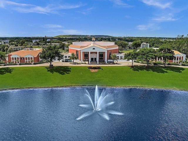 exterior space with a lawn and a water view