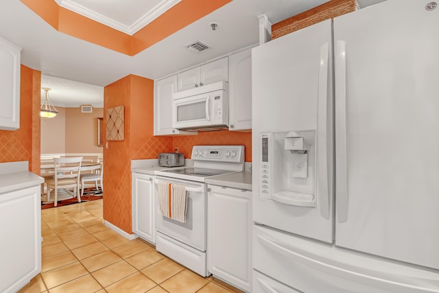 kitchen featuring white appliances, crown molding, white cabinetry, light tile floors, and tasteful backsplash