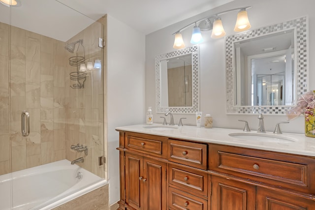 bathroom with enclosed tub / shower combo and dual vanity