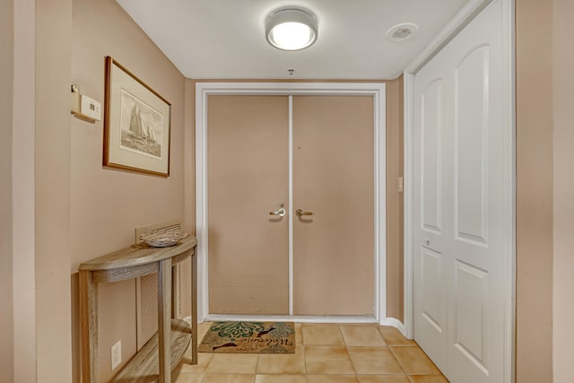 foyer entrance featuring light tile floors