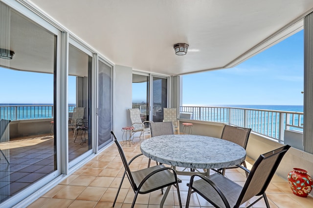 balcony featuring a water view