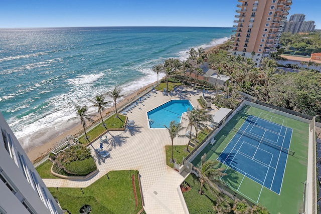 bird's eye view featuring a water view and a view of the beach