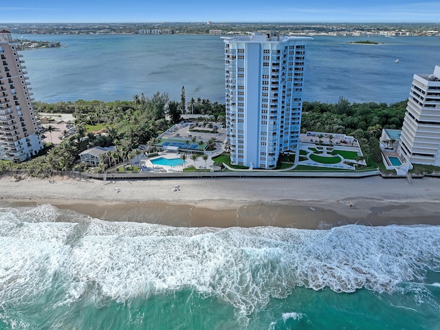 birds eye view of property featuring a water view and a view of the beach