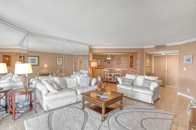 tiled living room with ornamental molding and a textured ceiling