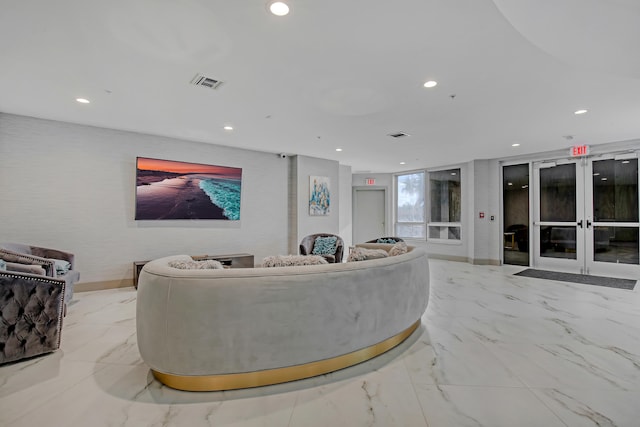 tiled living room featuring french doors