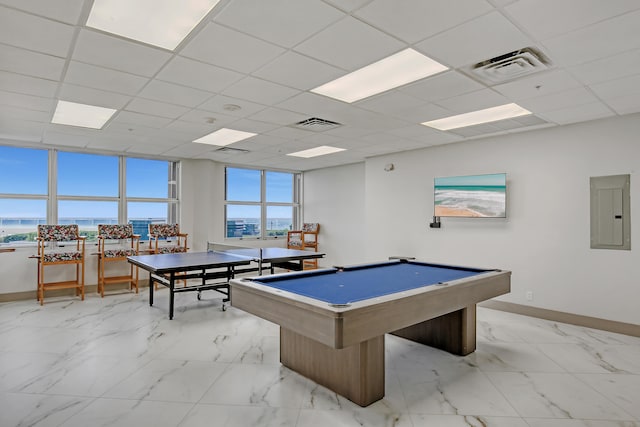 game room featuring a drop ceiling, light tile flooring, a wealth of natural light, and pool table