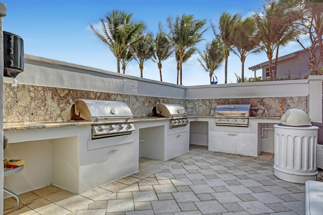 view of patio with a grill and exterior kitchen