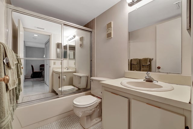 full bathroom with tile patterned floors, vanity, bath / shower combo with glass door, and toilet