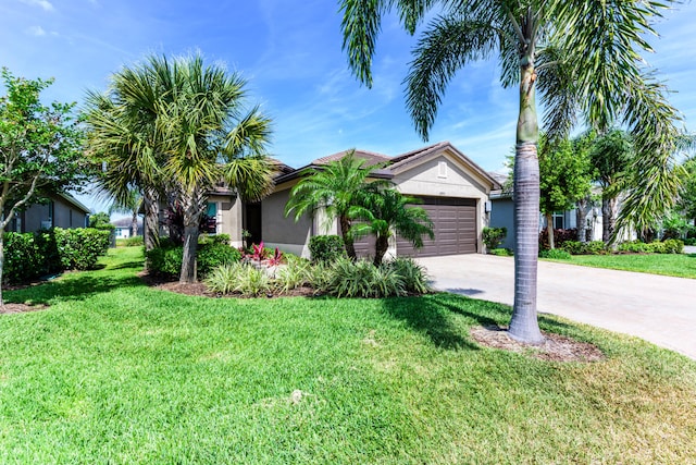 view of front of house with a garage and a front yard