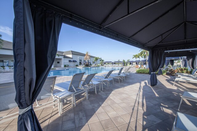 view of terrace featuring a community pool