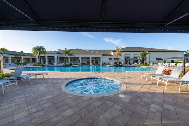 view of swimming pool with a patio area