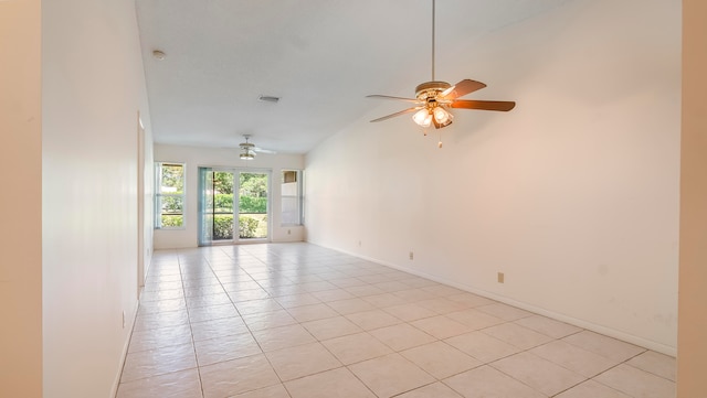 tiled spare room with high vaulted ceiling and ceiling fan