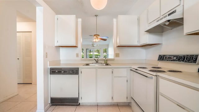 kitchen with custom exhaust hood, white appliances, white cabinets, sink, and ceiling fan