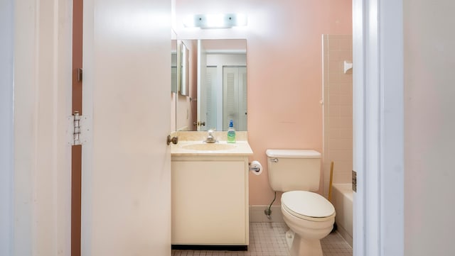 full bathroom featuring tiled shower / bath, toilet, tile flooring, and large vanity