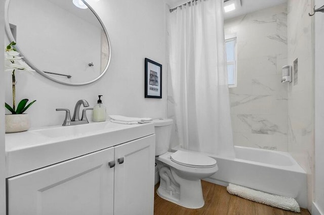 full bathroom featuring hardwood / wood-style floors, vanity, shower / bath combination with curtain, and toilet