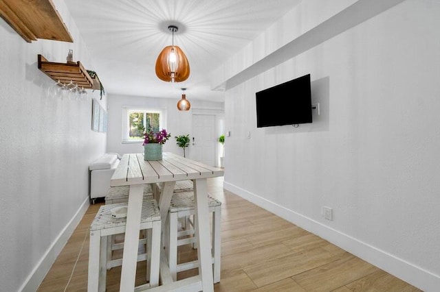 unfurnished dining area with light hardwood / wood-style flooring