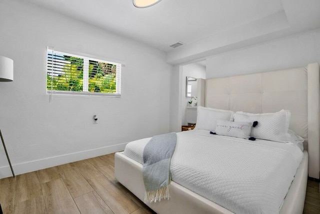 bedroom featuring hardwood / wood-style floors