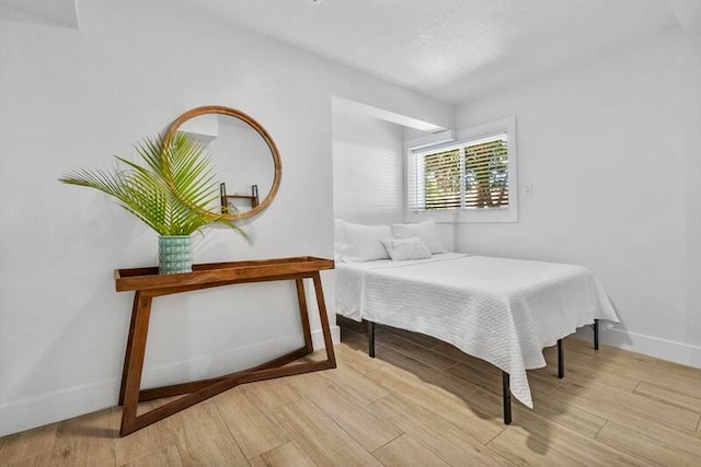 bedroom featuring light wood-type flooring