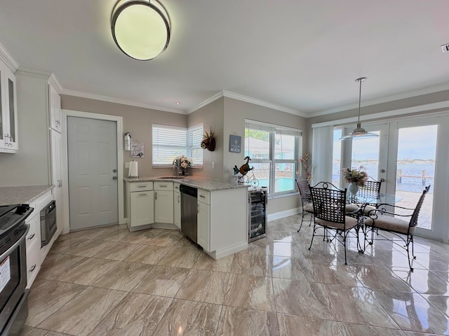 kitchen with light stone countertops, range, light tile patterned flooring, and wine cooler