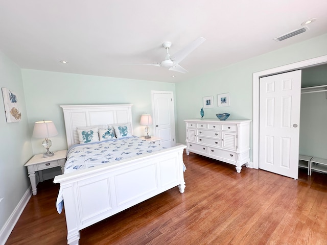 bedroom featuring ceiling fan, wood-type flooring, and a closet