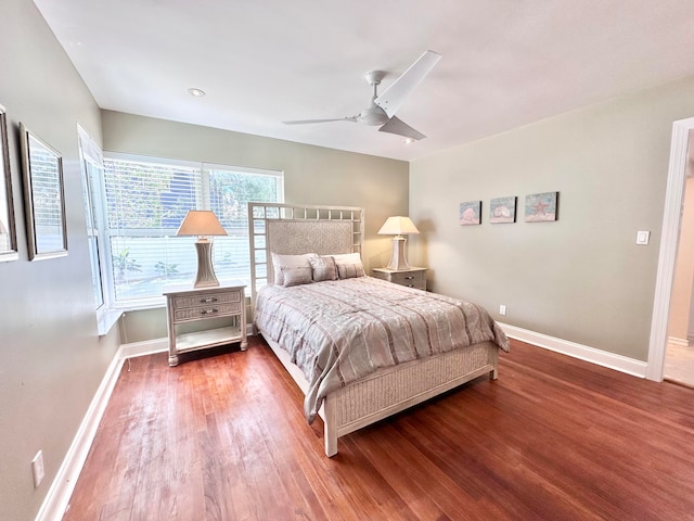 bedroom with hardwood / wood-style flooring and ceiling fan