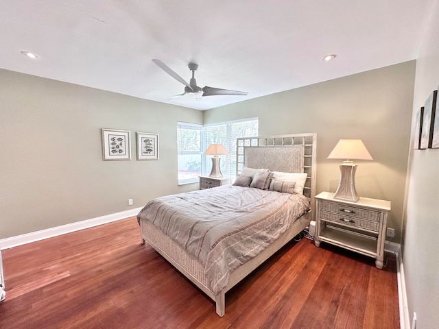 bedroom featuring dark hardwood / wood-style flooring and ceiling fan