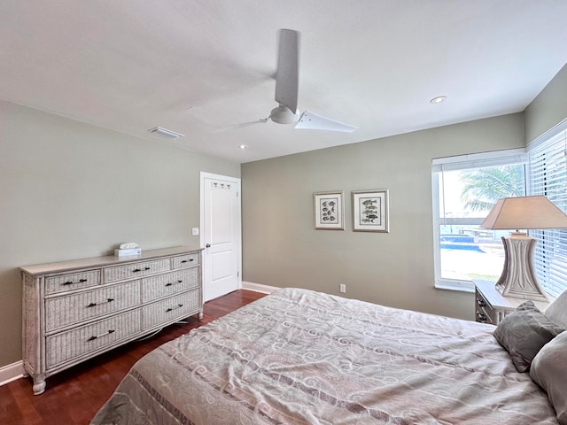 bedroom featuring ceiling fan and dark wood-type flooring