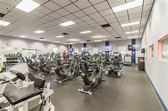 exercise room with a paneled ceiling