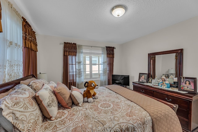 bedroom featuring a textured ceiling