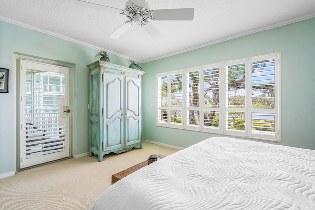 bedroom with access to exterior, ornamental molding, light colored carpet, ceiling fan, and a textured ceiling