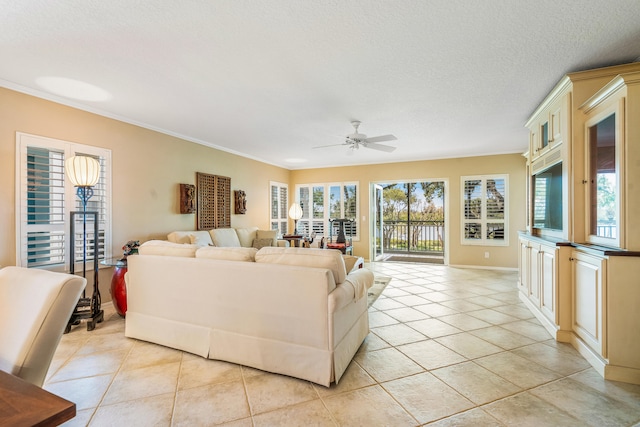 tiled living room with ceiling fan, crown molding, and a textured ceiling