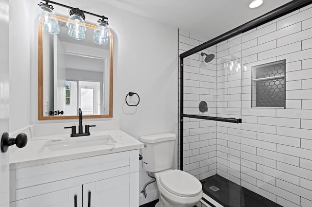 bathroom with walk in shower, oversized vanity, and toilet