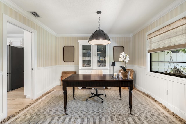 office space featuring ornamental molding and light hardwood / wood-style flooring