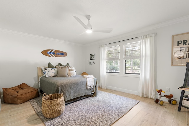 bedroom with ceiling fan, ornamental molding, and hardwood / wood-style flooring