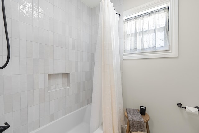 bathroom featuring shower / bath combination with curtain