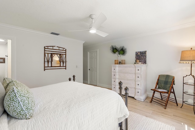 bedroom with ceiling fan, light wood-type flooring, and ornamental molding