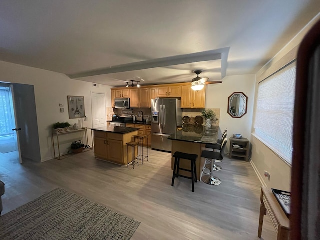 bedroom with light wood-type flooring, ceiling fan, and access to outside